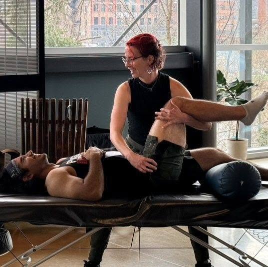 Becca working with a client in the treatment room